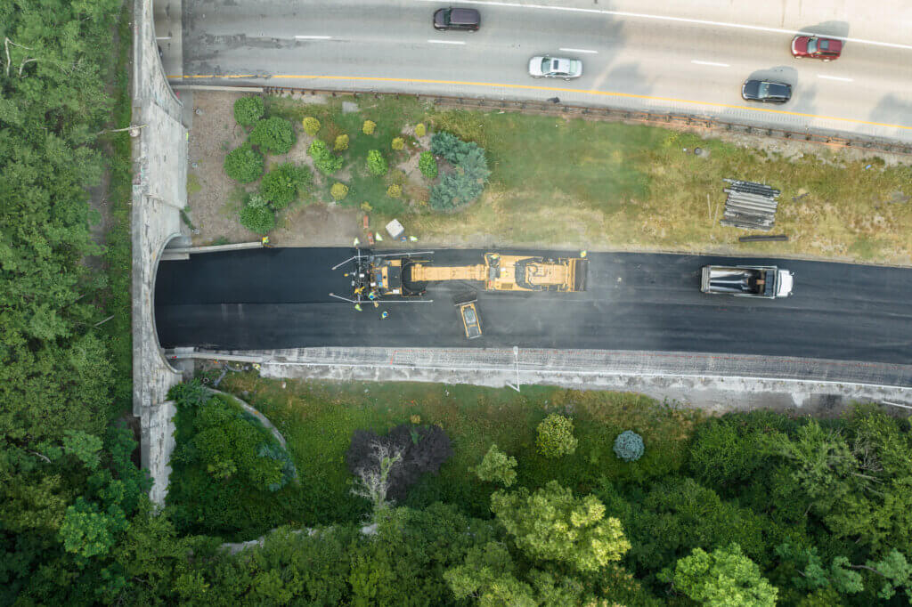Bird's eye view of new pavement leading into tunnel