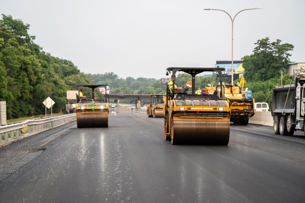Multiple construction vehicles on a new road